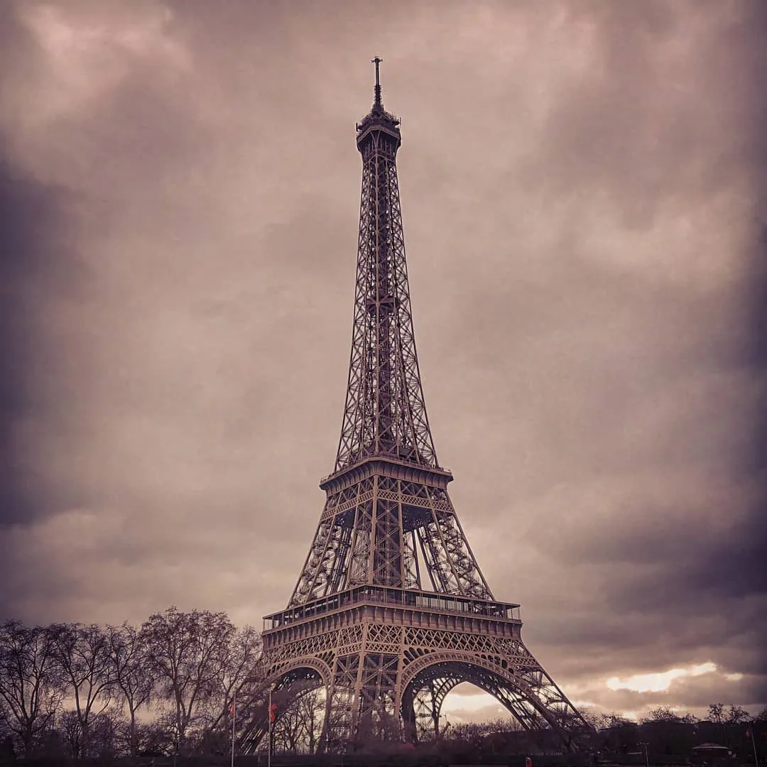 The Eiffel Tower in Paris seen from below - Paris Travel Guide