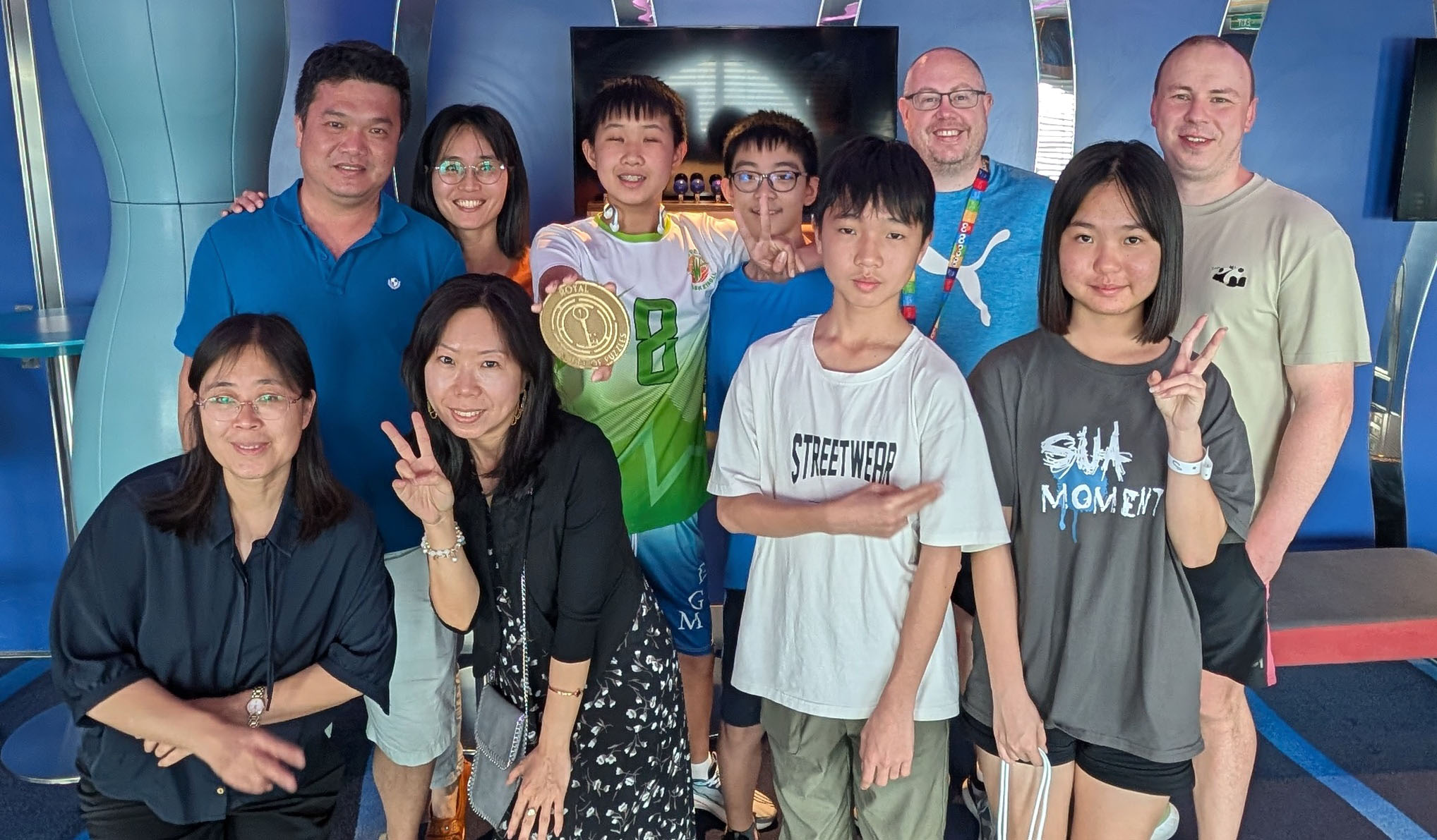 Our team holding the prize after winning the Royal Society of Puzzles game