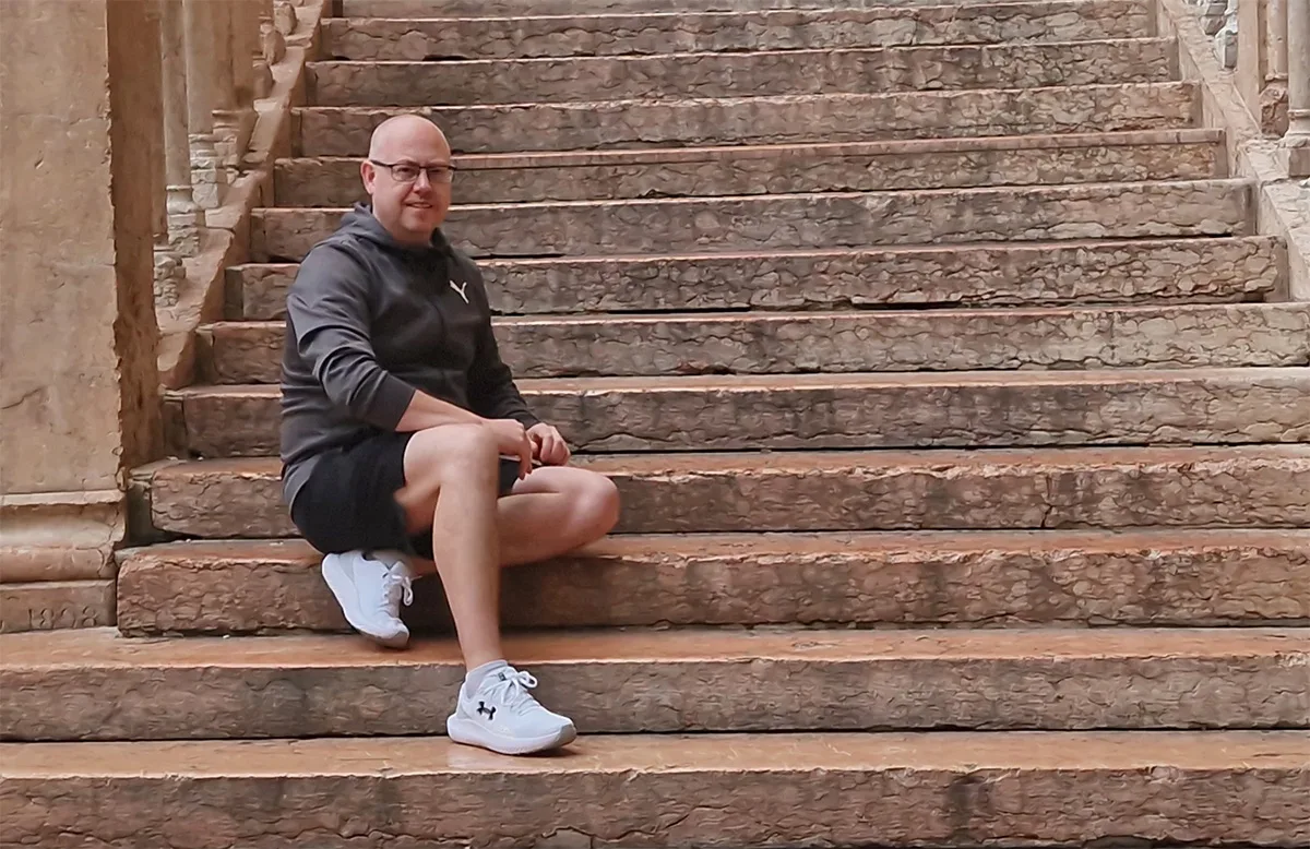 Relaxing on the marble steps of Piazza Bra near the Verona Arena during a Verona day trip