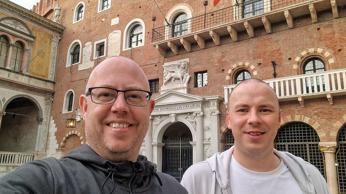 Kolyn and Denis standing in the Piazza Bra during an evening trip to Verona