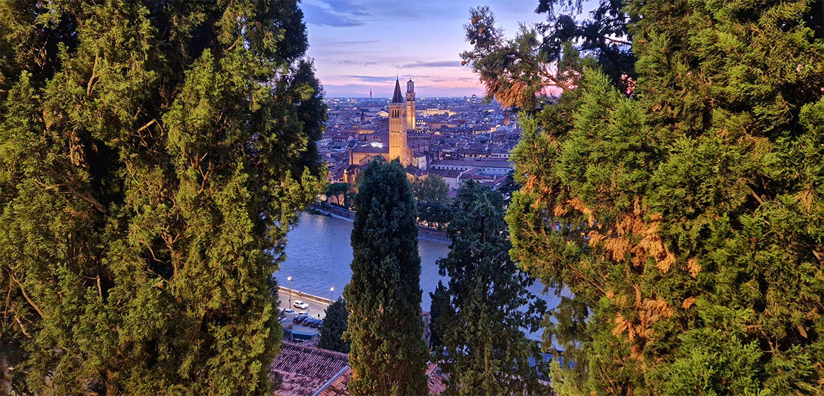 Panoramic sunset view of the Verona old town rooftops from the Castel San Pietro terrace