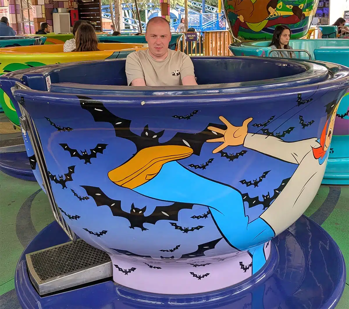 Denis riding the Scooby Doo teacups attraction at Parque Warner - Madrid Travel Guide