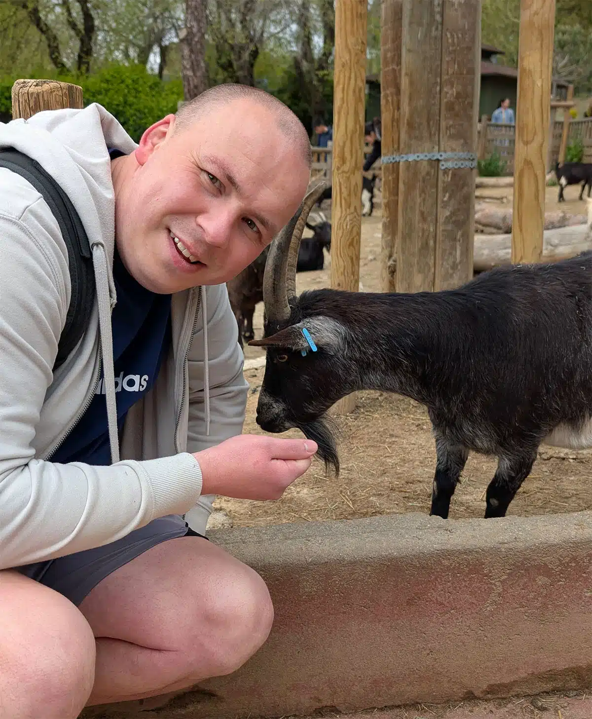 Denis feeding the goats at Zoo Aquarium Madrid - Madrid Travel Guide