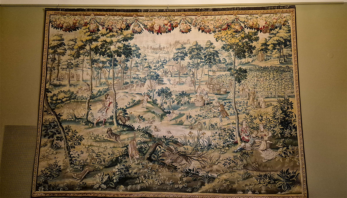 An intricate historic tapestry on display inside the royal palace in Vilnius, Lithuania