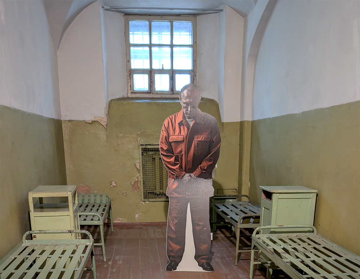 A cardboard cut-out of Vladimir Putin in a cell in the KGB Museum Vilnius prison