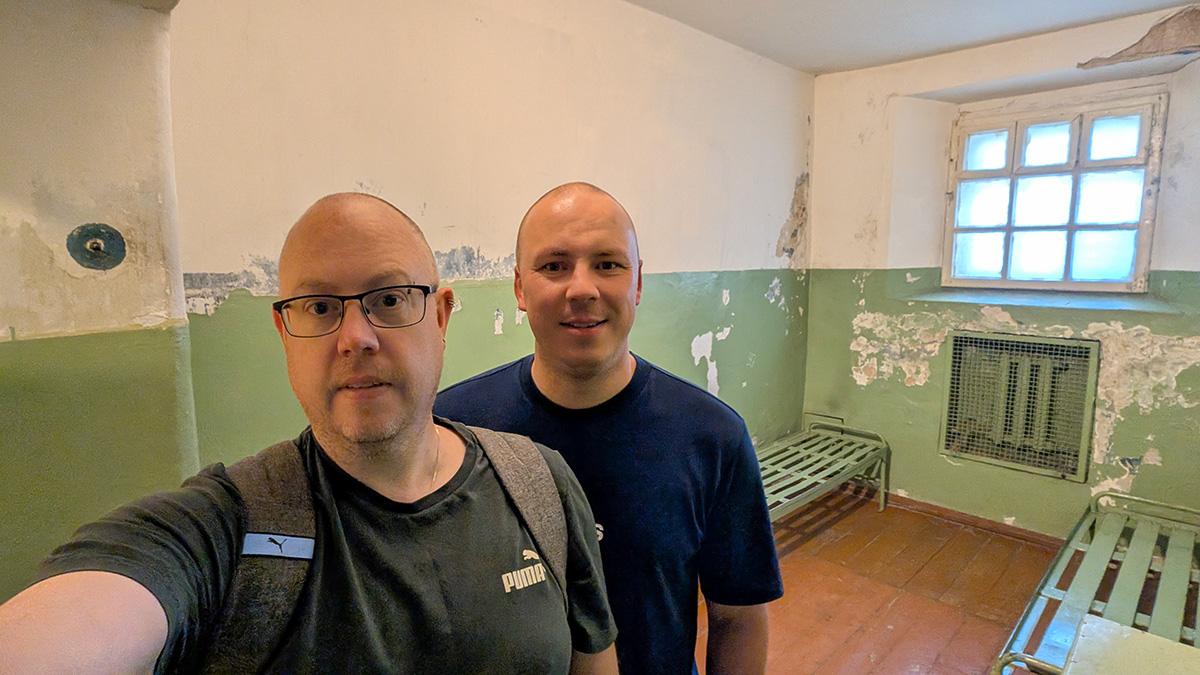 The Curious Tourists inside a damp cell at the Museum of Occupations and Freedom Fights in Vilnius