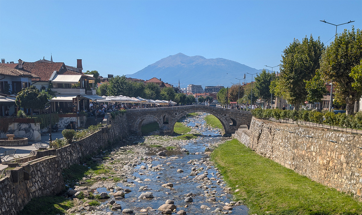 Looking across the slippery Old Stone Bridge on a sunny Prizren day trip