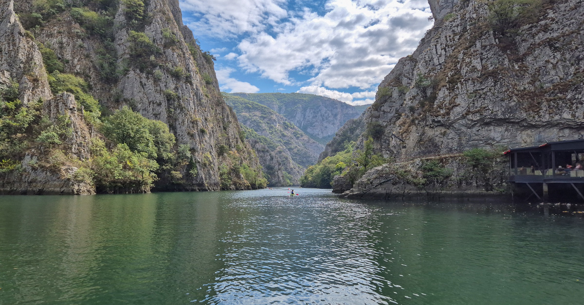 A view of a kayaker on the lake at Matka Canyon in North Macedonia