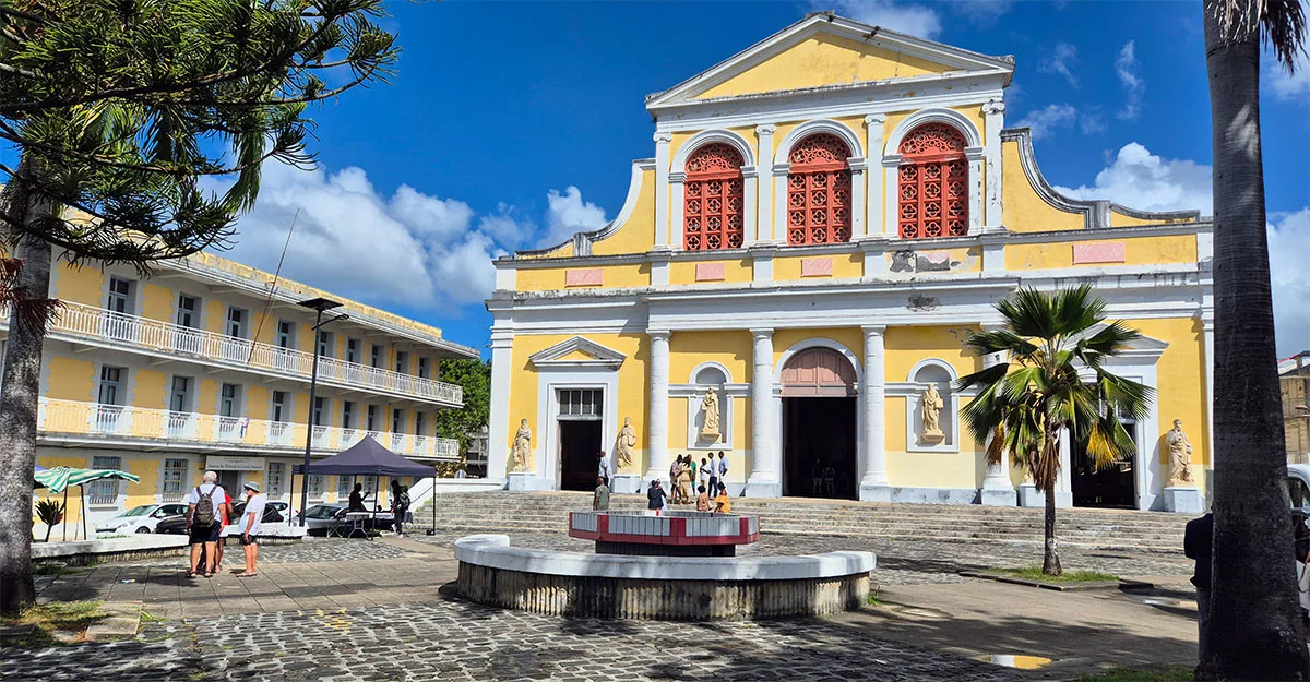 The yellow and white Cathedral of St Pierre and St Paul in central Pointe-à-Pitre